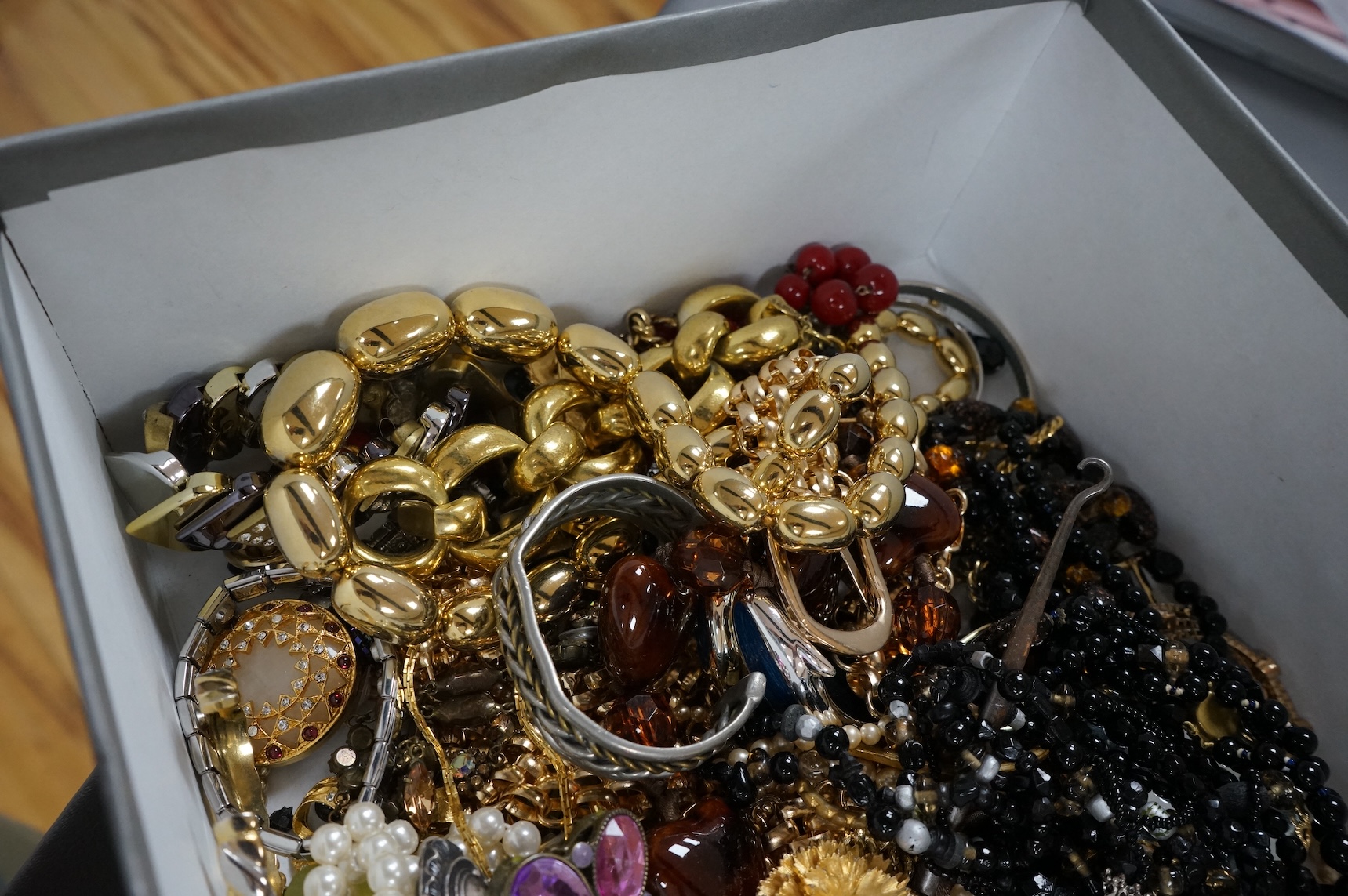 A quantity of assorted recent costume jewellery and two silver handled button hooks.